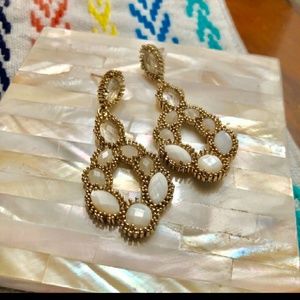 Kendra Scott dangle earrings.